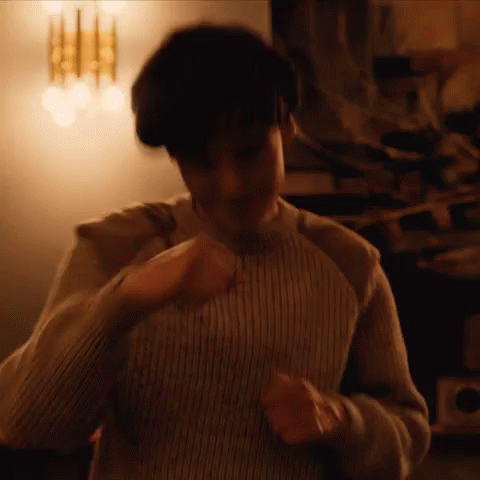 Man in Striped Sweater Dancing