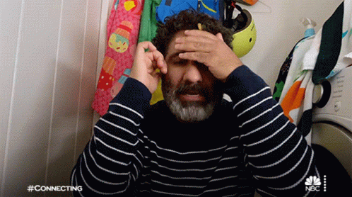 Man in Striped Sweater Saying Connecting