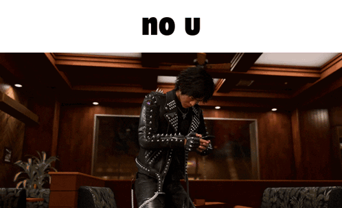 Man in Studded Leather Jacket Holding Gun