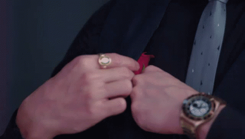 Man In Suit Adjusting Tie With Watch GIF