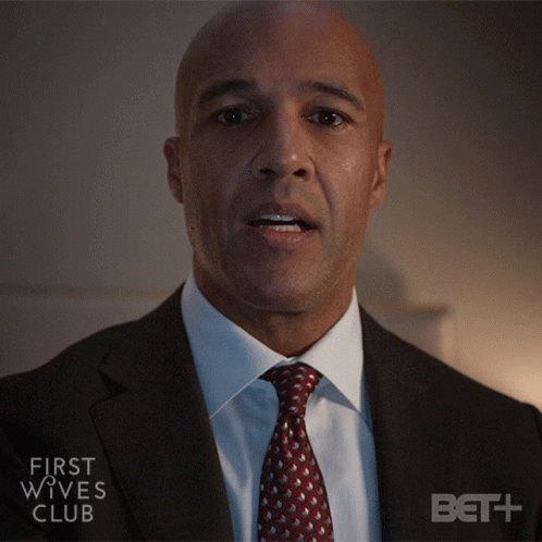 Man in Suit Advertising First Wives Club on BET