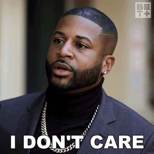Man in Suit and Black Turtleneck Saying I Don't Care