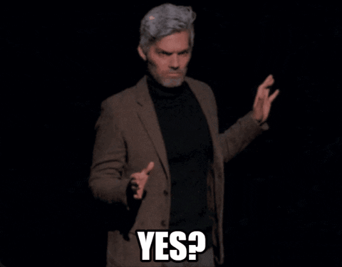 Man in Suit and Black Turtleneck Saying Yes