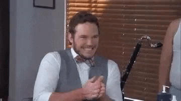 Man in Suit and Bow Tie Clapping