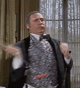 Man In Suit And Bow Tie Hands Up GIF