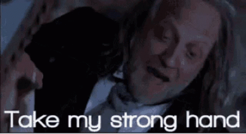 Man In Suit And Bow Tie Laying Down Saying Take My Strong Hand GIF