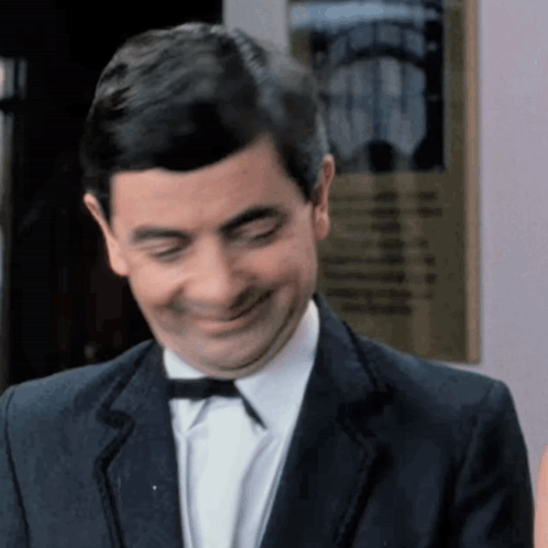 Man In Suit And Bow Tie Smiling GIF
