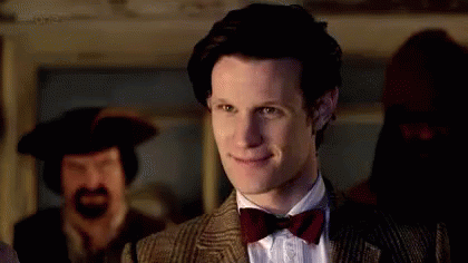 Man in Suit and Bow Tie Smiling