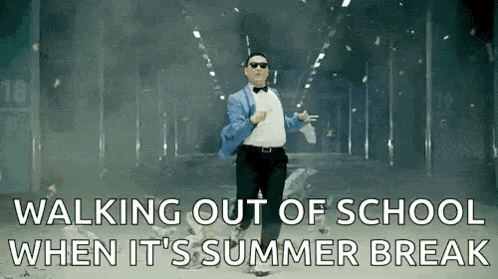 Man in Suit and Bow Tie Walking Out of School