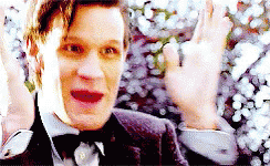 Man in Suit and Bow Tie Waving