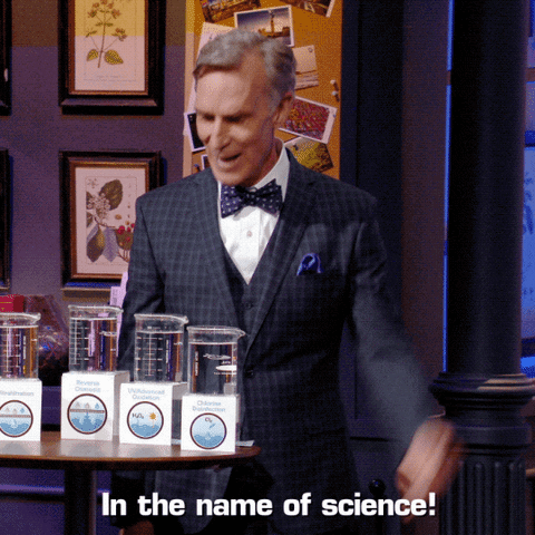 Man In Suit And Bow Tie With In The Name Of Science Boxes GIF