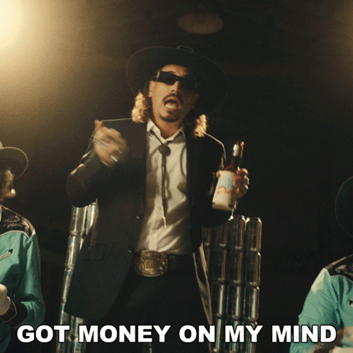 Man in Suit and Cowboy Hat Holding Bud Light