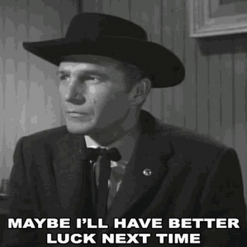 Man in Suit and Cowboy Hat Saying Maybe Better Luck Next Time