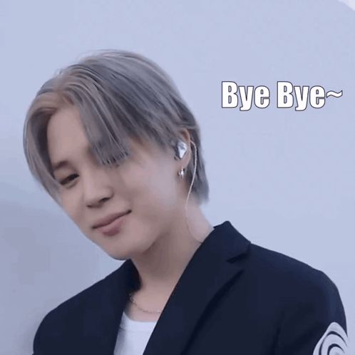 Man in Suit and Earbuds Saying Bye Bye