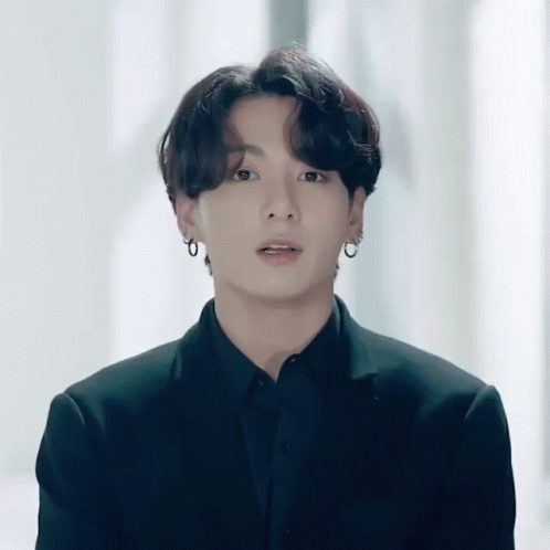 Man in Suit and Earrings