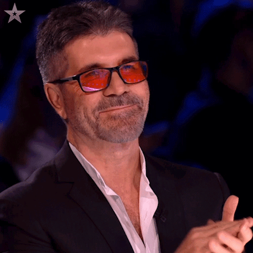 Man In Suit And Glasses Applauding GIF