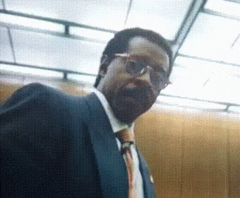 Man in Suit and Glasses Looking