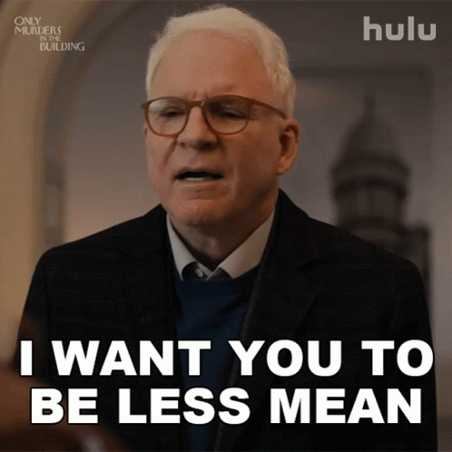 Man in Suit and Glasses Says Be Less Mean