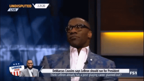 Man in Suit and Glasses Talking on Undisputed