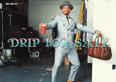 Man in Suit and Hat Holding Red Cup and Brown Bag Drip for Sale