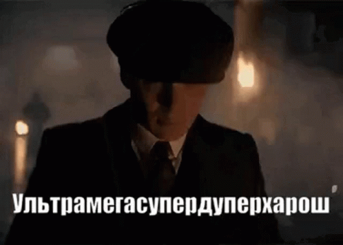 Man in Suit and Hat in Dark Room With Foreign Language