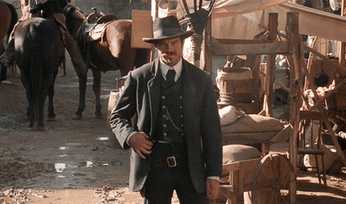 Man In Suit And Hat In Muddy Area GIF