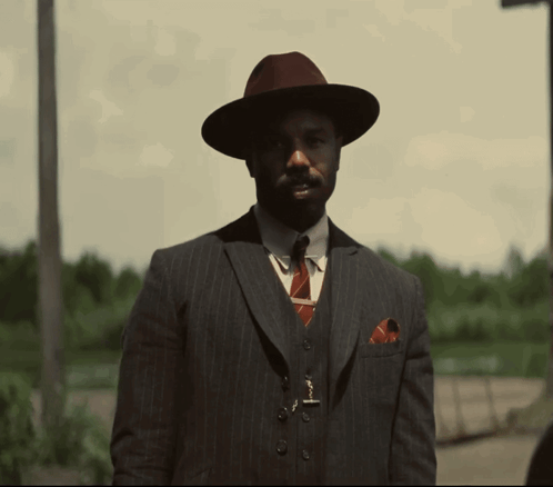 Man in Suit and Hat Nah We Good