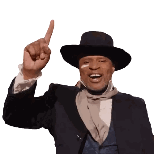 Man in Suit and Hat Pointing Up