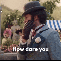 Man in Suit and Hat Saying How Dare You