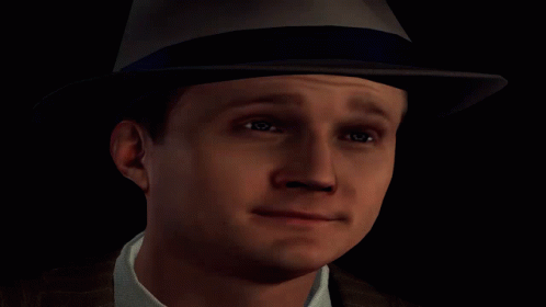 Man in Suit and Hat with Blue X
