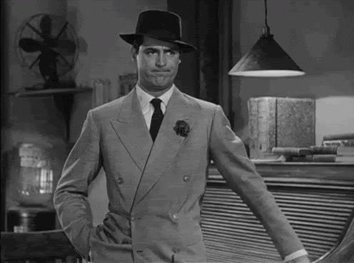 Man in Suit and Hat With Hand in Pocket