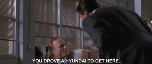 Man In Suit And Man Saying You Drove A Hyundai To Get Here GIF