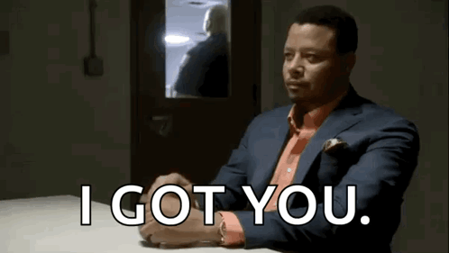 Man in Suit and Orange Shirt Saying I Got You
