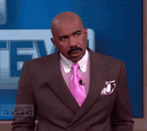 Man In Suit And Pink Tie In Front Of Steve TV GIF