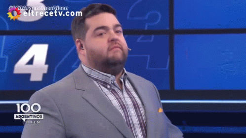 Man in Suit and Plaid Shirt Facing 100 Argentinas