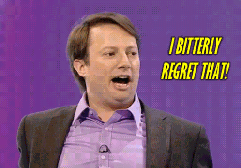 Man in Suit and Purple Shirt Saying I Regret