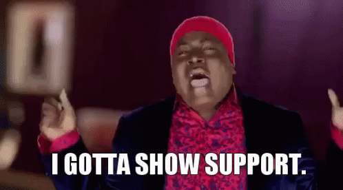 Man In Suit And Red Hat Saying I Gotta Show Support GIF