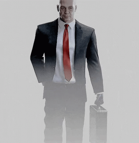 Man in Suit and Red Tie Holding Briefcase
