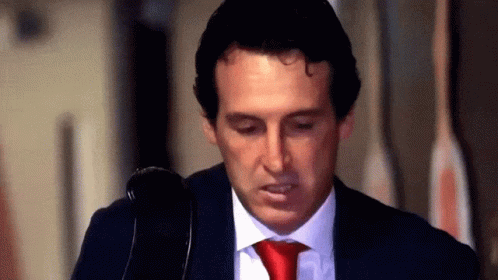 Man in Suit and Red Tie Looking Down