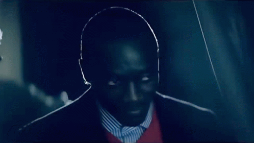 Man In Suit And Striped Shirt Looking GIF