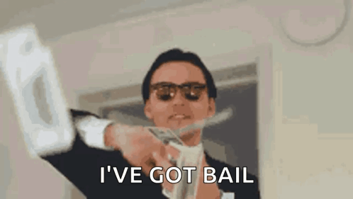 Man in Suit and Sunglasses Holding Money Saying I Have Got Bail