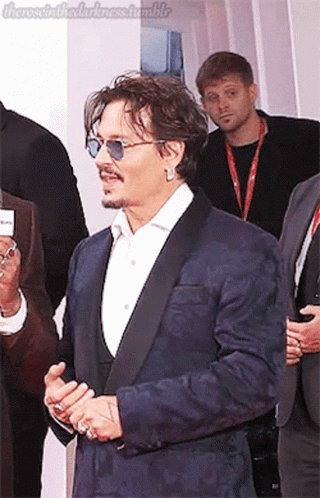 Man in Suit and Sunglasses on Red Carpet