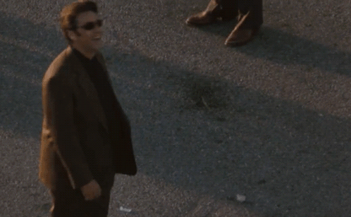 Man in Suit and Sunglasses Saying Okay
