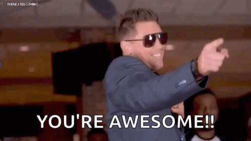 Man in Suit and Sunglasses Saying You're Awesome