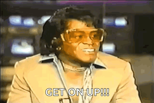 Man in Suit and Sunglasses Says Get On Up