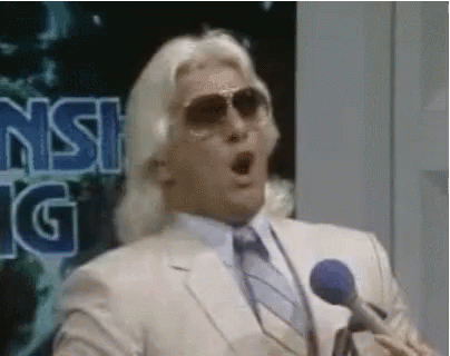 Man in Suit and Sunglasses Speaking