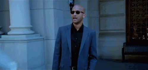 Man in Suit and Sunglasses Standing
