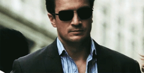 Man In Suit And Sunglasses Walking Down Street GIF