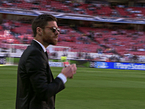 Man in Suit and Sunglasses Walking