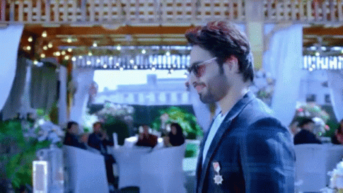 Man In Suit And Sunglasses With People GIF